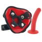 Black adjustable straps with heart-shaped piece at the front that secures a small red silicone dildo.