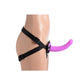 Black adjustable straps with triangular piece at the front that secures a small purple silicone dildo