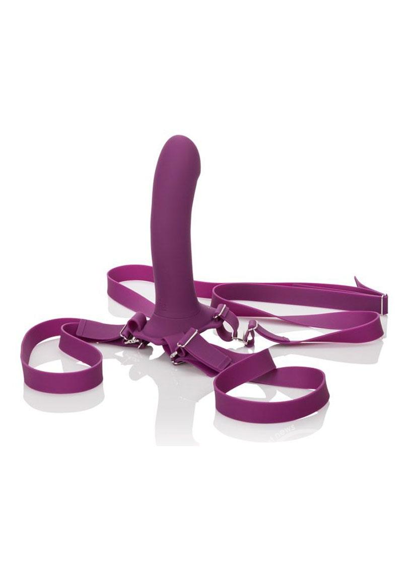 Purple adjustable straps with secured purple silicone dildo at the front.