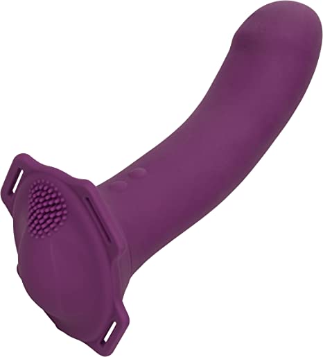 Purple dildo with 4 holes for straps and textured top for wearer. Two small buttons at base.
