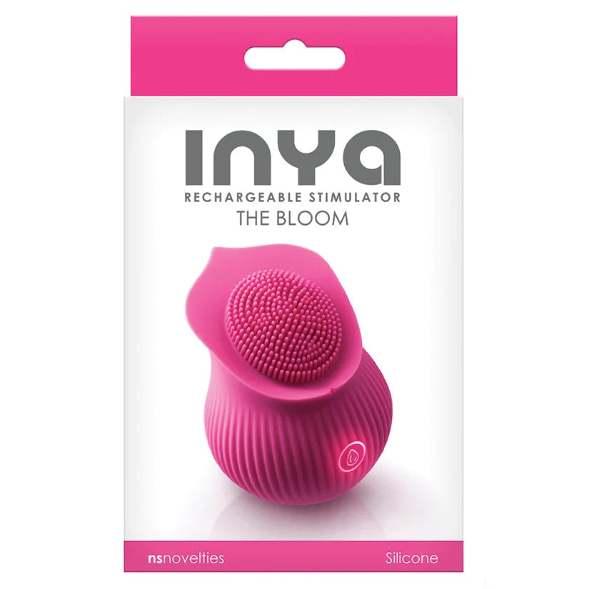 Pink rose shaped vibrator with tiny finger like texture in the center for clitoral stimulation. One illuminated power control button on the front. Packaged in pink and white box.