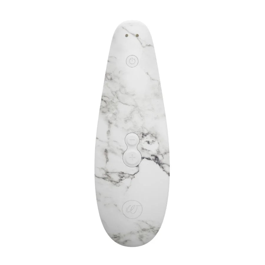 white marble clitoral stimulator with three buttons on back.