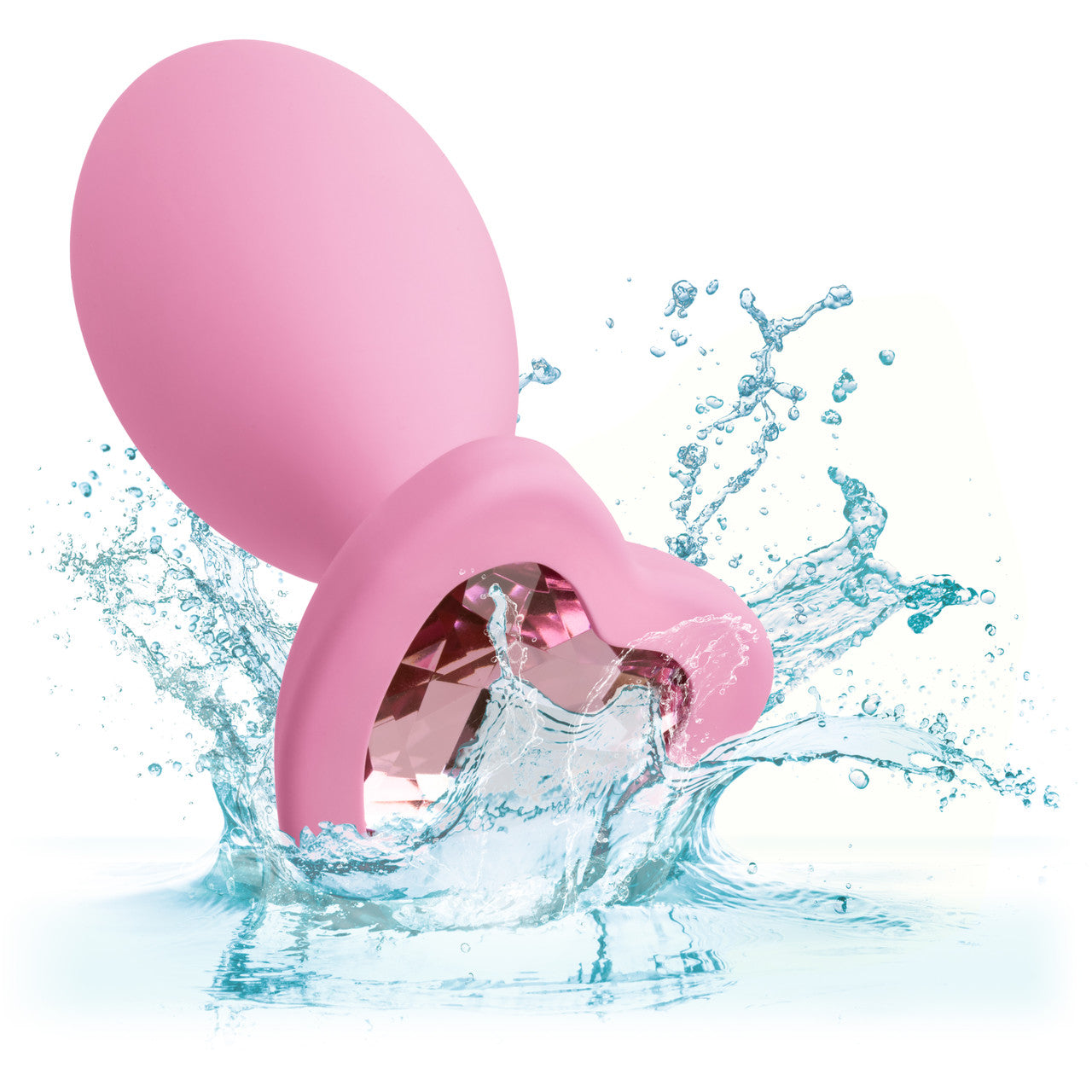 Pink egg shaped anal plug with a heart shaped gem at base splashing in water.