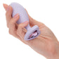 Hand holding pale purple egg shaped anal plug with a heart shaped gem at base.