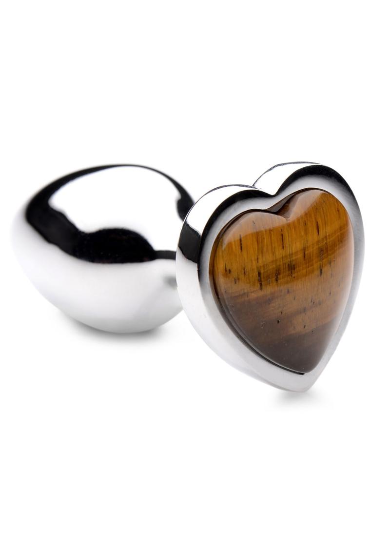 Aluminum anal plug with bulbous teardrop shape. Base is heart shaped with tiger eye gem in center. 